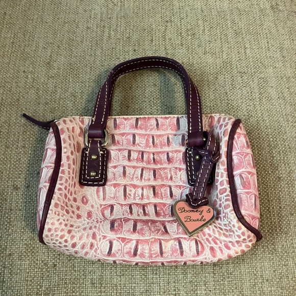 Dooney & Bourke Handbags - Vintage Dooney and Bourke pink ostrich mini hand bag